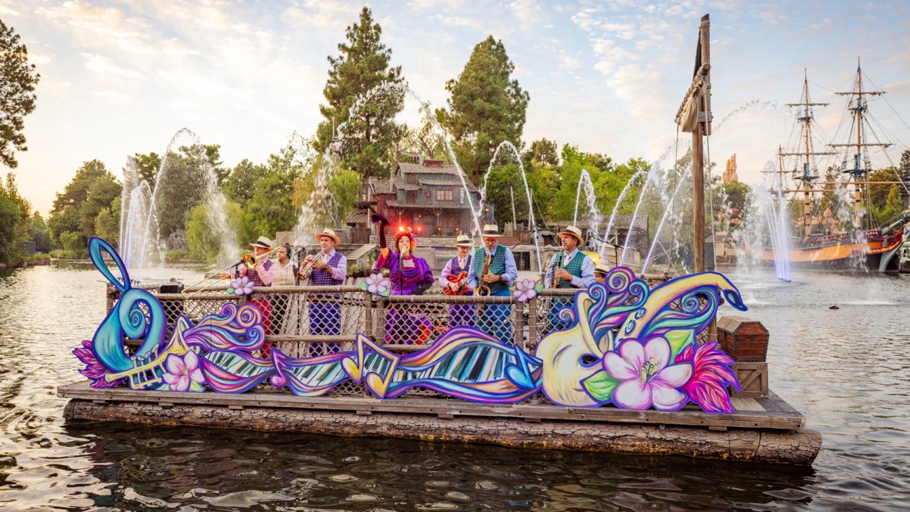 Queenie and the Jambalaya Jazz Band perform high-energy New Orleans tunes, plus other Disney favorites each evening as they float on a New Orleans-themed raft down the Rivers of America at Disneyland Park in Anaheim, Calif.  Throughout each set, fountains and lighting create a beautiful ambient atmosphere. In addition to her dazzling performance, Queenie leads musical call-and-response interactions with Guests, and always shares her sense of fun. (Christian Thompson/Disneyland Resort)